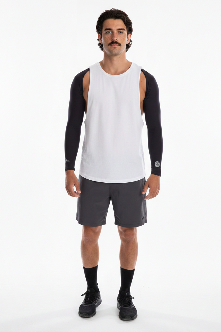 Man wearing a white tank top with black sleeves and gray shorts on a white background